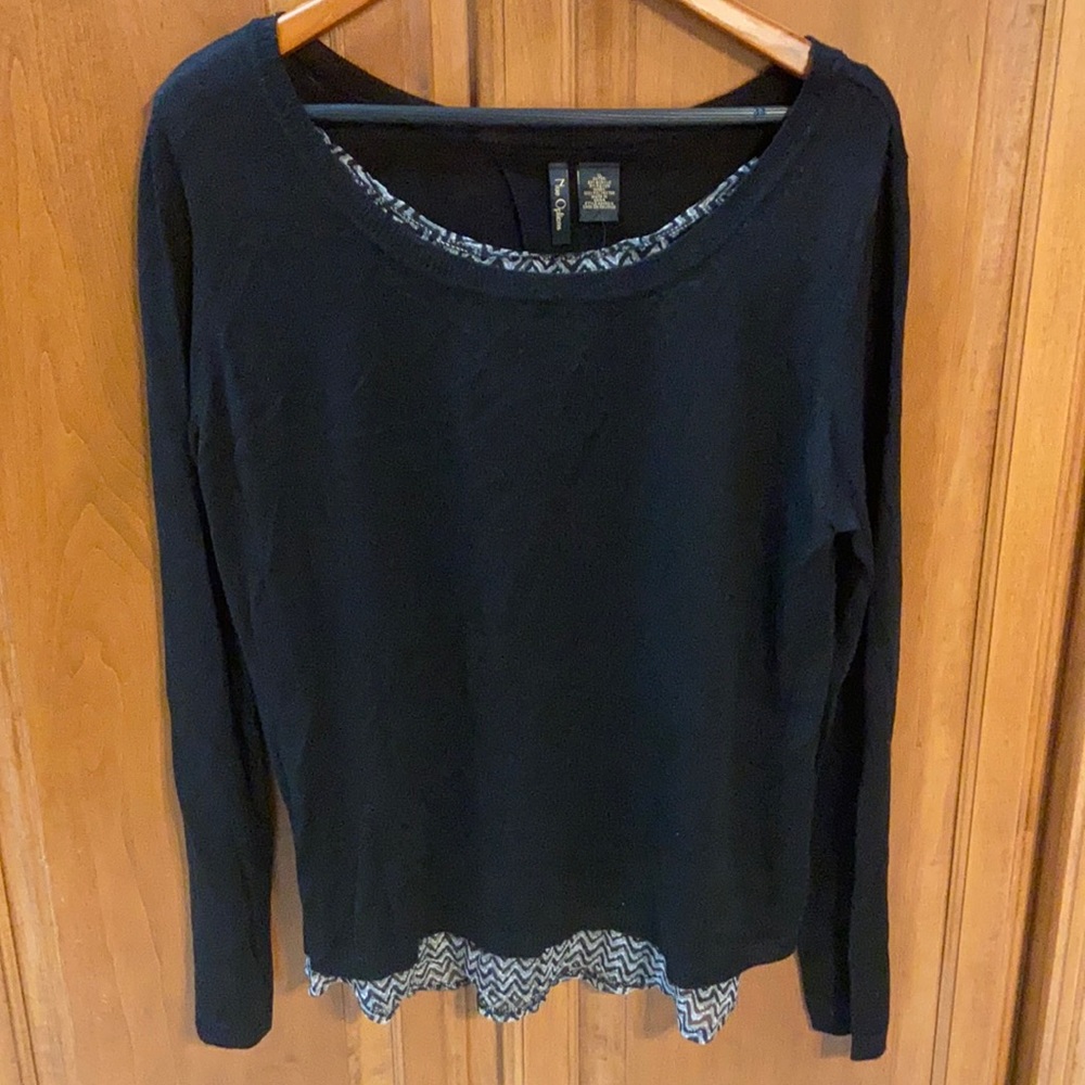 Black long sleeve sweater with open back.